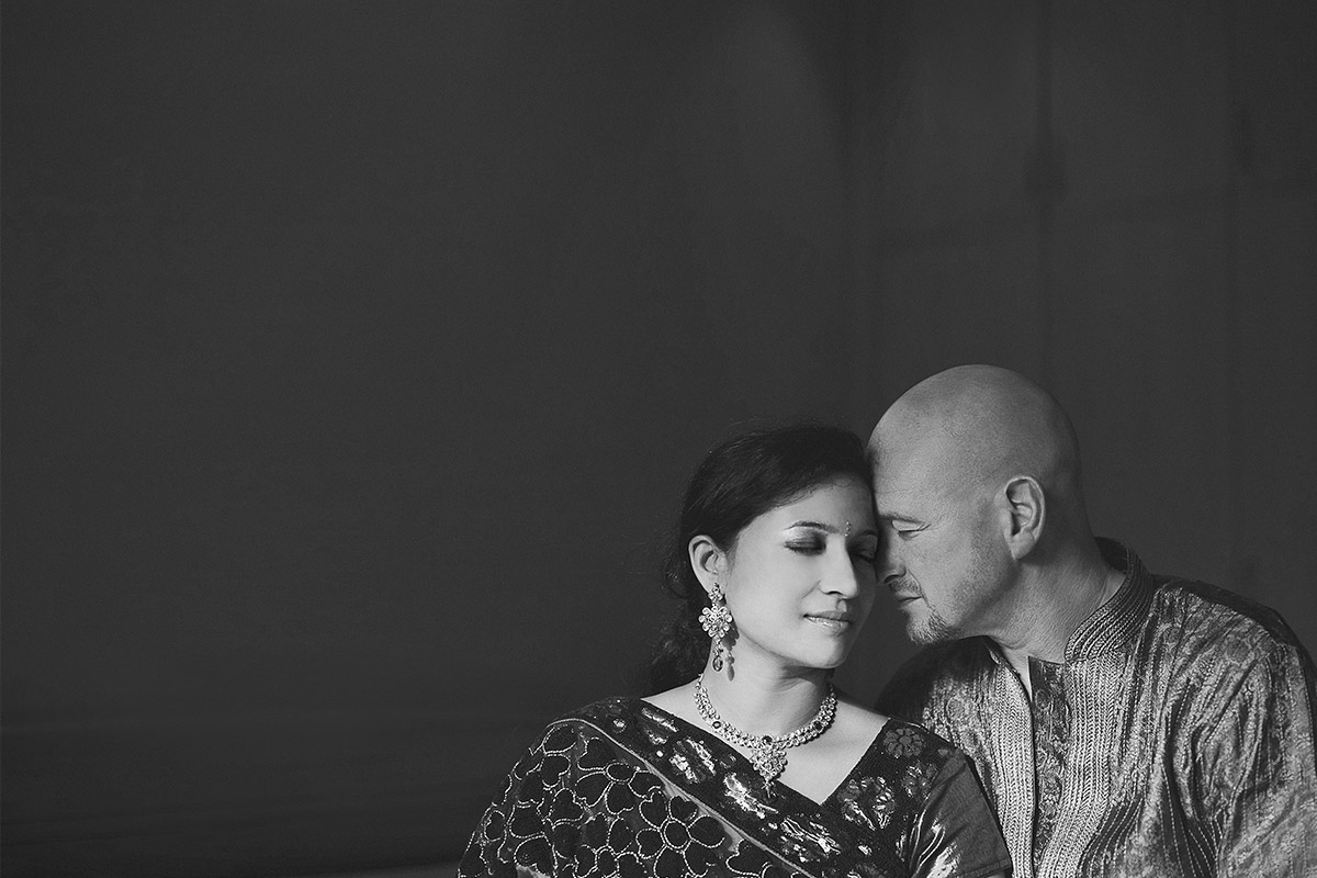 hindu bride and groom with eyes closed at Indian wedding