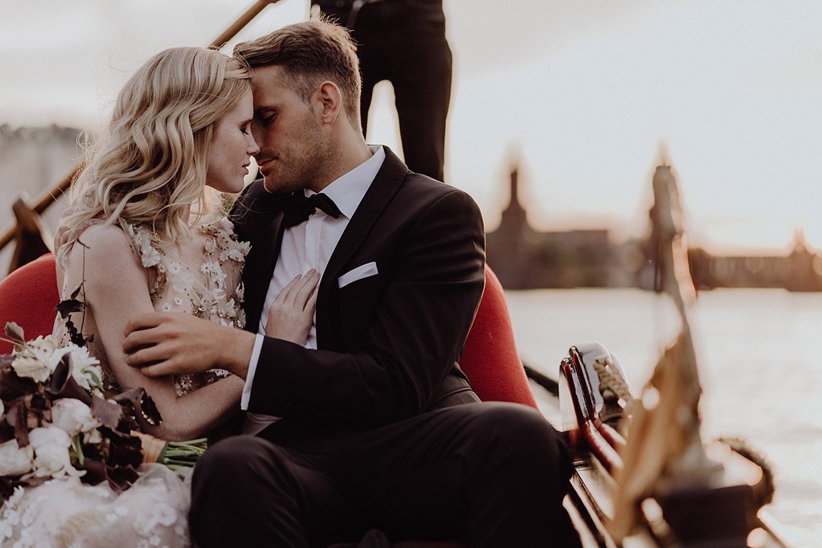 elopement wedding Berlin bridal couple cuddle in the boat on the Spree